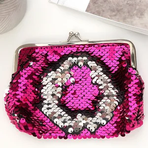 Detailed view of magenta sequin coin purse with silver vintage metal clasp and shiny texture