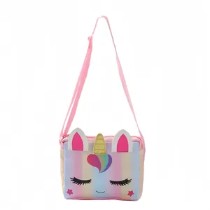 Detail of cute unicorn crossbody bag with macaron gradients and golden unicorn horn