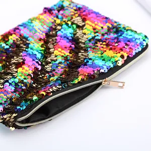Rainbow reversible sequin mermaid makeup bag with gold zipper and colorful wave pattern