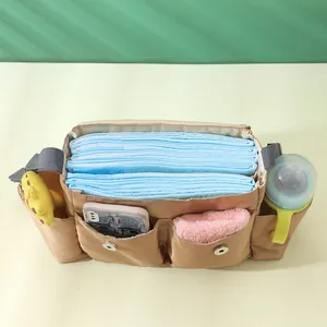 Detailed view of diaper organizer bag storage capacity for baby essentials and bottle