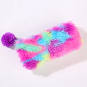 Detail of colorful rainbow plush pencil case with soft faux fur texture and pompom