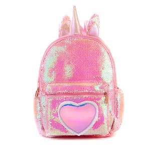 Close-up of sparkling sequin unicorn backpack with holographic heart and 3D ears