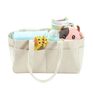 Corduroy diaper bag interior view showing large storage capacity for baby supplies