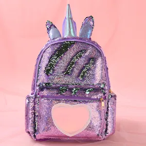 Detail of purple sequin unicorn backpack with a 3D horn and pink heart pocket