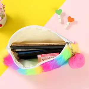 Internal view of rainbow plush pencil case showing large capacity for stationery storage