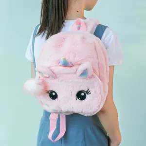 Detail view of a pink plush unicorn backpack with soft fur and shiny horn embroidery