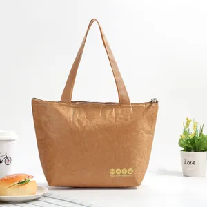 Detail of insulated Tyvek lunch bag with zipper and handle on a white background