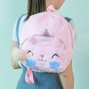 Pink plush unicorn cat backpack for girls featuring rainbow horn and fuzzy shell details