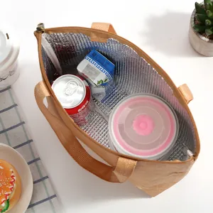 Internal view of brown DuPont paper lunch bag showing the insulated silver aluminum foil lining