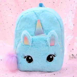 Detail of plush blue unicorn backpack with rainbow sequin horn and pink pompom