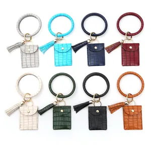 Porte-cartes bracelet en cuir PU crocodile avec pompon, disponible en huit couleurs variées