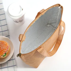 Detail of insulated lunch bag showing thick aluminum foil lining and a secure zipper closure