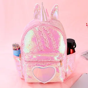 Detailed view of pink sequin unicorn backpack with silver horn and side pockets for school