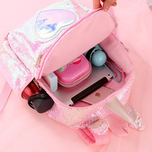Pink sequin unicorn backpack showing spacious main compartment with everyday essentials