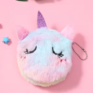 Close-up of fluffy plush unicorn coin purse with rainbow gradient and silver chain