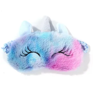 Macro shot of fluffy unicorn sleep mask with embroidered eyelashes and silver horn