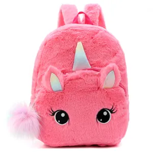 Detail of plush unicorn backpack featuring soft pink fur and glittery horn accents