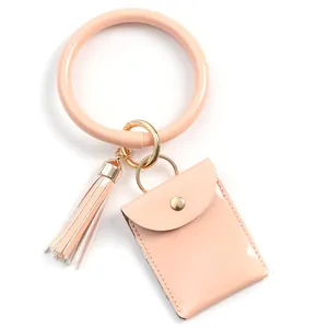 Peach pink wristlet keychain set with small coin purse and decorative fringe tassel