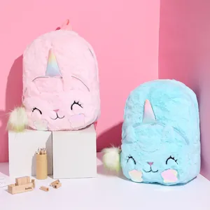 Close-up of plush unicorn cat backpack with sequins and fluffy ball charms