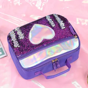Detail of purple sequin lunch bag featuring a heart holographic patch and zipper pocket