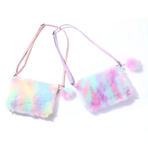 Detailed view of plush rainbow faux fur crossbody bags with soft pompom charms
