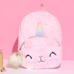 Detail of soft pink plush unicorn backpack with cat embroidery and rainbow horn
