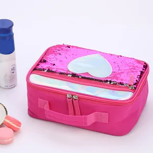 Close-up of pink sequined lunch bag with heart patch and laser transparent zipper pocket