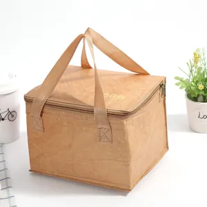 Macro detail of brown Tyvek lunch bag showing waterproof texture and gold zipper closure