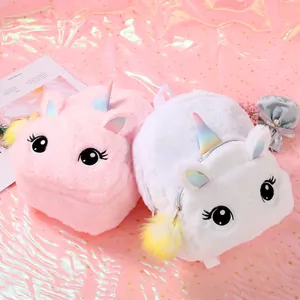Close-up of plush unicorn backpacks with rainbow horns and cute embroidered eyes