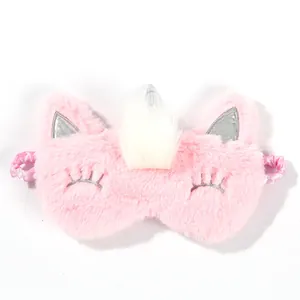 Close-up of pink plush unicorn eye mask showing soft fur and silver ear detail