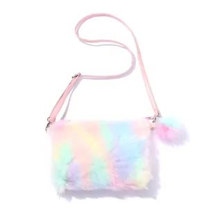Detailed texture of fluffy rainbow plush faux fur with a pink leather strap and pompom charm