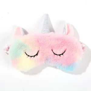 Detailed macro view of colorful unicorn plush sleep mask with soft texture and silver horn