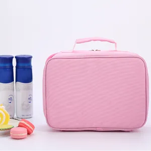 Detailed side view of pink fabric lunch bag with sturdy handle and dual zippers