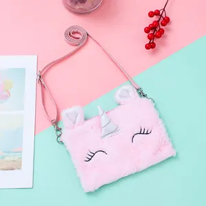 Detail of pink plush unicorn crossbody bag with sequin horn and thin faux leather strap