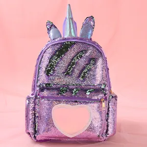 Sparkly purple sequin unicorn backpack with a pink heart design and 3D horn detail