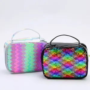 Detail view of colorful sequin lunch bags with holographic and black leather trim accents