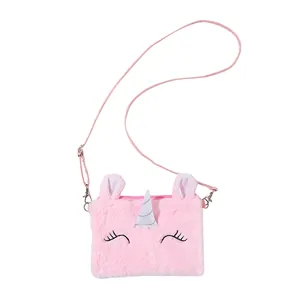 Detailed view of the pink plush unicorn crossbody bag with silver horn and embroidery