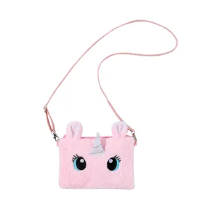 Detail of pink plush unicorn crossbody bag with silver horn and embroidery for girls