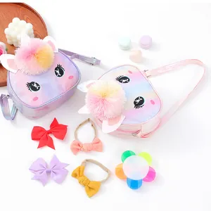 Children's glitter unicorn crossbody bag with rainbow gradient and fluffy pompom accents