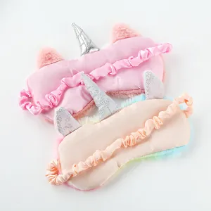 Pink and rainbow plush unicorn sleep masks with shiny silver horns and satin elastic straps