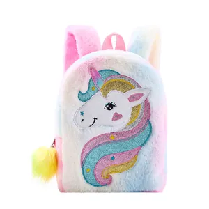 Detailed view of rainbow plush unicorn backpack with glitter embroidery and fuzzy pompom