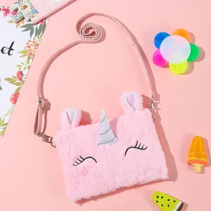 Pink plush unicorn crossbody bag with sequin horn and adjustable strap detail view