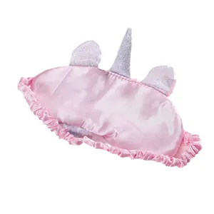 Pink plush unicorn sleep mask with silver horn and satin back for blackout comfort