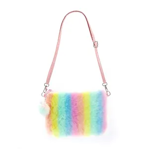 Close-up of rainbow plush texture with pink leather strap and decorative pom pom charm