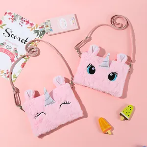 Detail of pink plush unicorn crossbody bags with embroidery and silver horn accents
