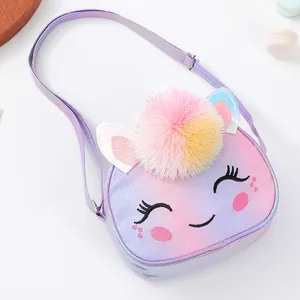 Close-up of glitter unicorn bag featuring pink pom-pom and cute cartoon embroidery
