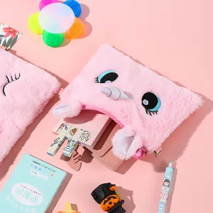 Detailed macro view of pink plush unicorn bag with embroidery and smooth zipper closure