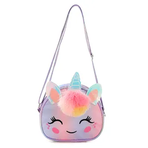 Detail of unicorn glitter crossbody bag with embroidery eyes and plush pink pom pom