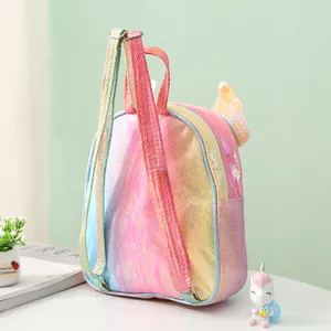Detail view of colorful iridescent backpack with 3D wing design and sparkly texture