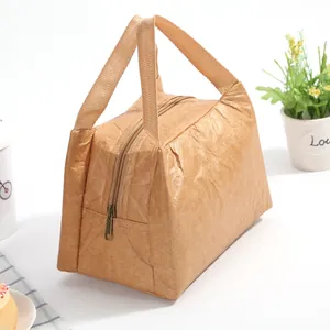 Detail of Tyvek paper lunch bag showing the durable texture and sturdy webbing handles